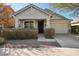 Charming home featuring a covered porch, desert landscaping, and an attached two-car garage at 7924 S 24Th Pl, Phoenix, AZ 85042