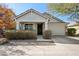 Inviting single-story home featuring a covered porch, desert landscaping, and an attached two-car garage at 7924 S 24Th Pl, Phoenix, AZ 85042