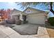 Beautiful one-story home with a covered porch, desert landscaping, and an attached two-car garage at 7924 S 24Th Pl, Phoenix, AZ 85042