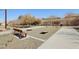 Community bocce ball or cornhole court with benches and shade trees, offering a recreational space at 7924 S 24Th Pl, Phoenix, AZ 85042