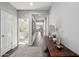 Inviting hallway showcasing wood floors and tasteful decor leading to a bedroom and other living spaces at 7924 S 24Th Pl, Phoenix, AZ 85042