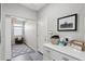 Inviting mudroom with storage, decor and access to the living room offers practicality and style at 7924 S 24Th Pl, Phoenix, AZ 85042