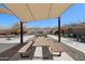 Outdoor picnic area featuring tables, benches, and overhead shades in a community gathering space at 7924 S 24Th Pl, Phoenix, AZ 85042