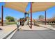 Community playground featuring a slide, climbing structures and shade canopies for sun protection at 7924 S 24Th Pl, Phoenix, AZ 85042