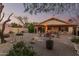 Charming backyard featuring a covered patio, a seating area and tasteful landscaping at 80 S Maple Ct, Chandler, AZ 85226