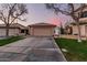 Charming single-story home featuring a spacious driveway and well-maintained front yard with desert landscaping at 80 S Maple Ct, Chandler, AZ 85226