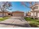 Charming single-story home featuring a spacious driveway and well-maintained front yard with desert landscaping at 80 S Maple Ct, Chandler, AZ 85226