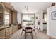 Cozy dining room featuring a light fixture, built in cabinets and view of the outdoors at 8233 E Calypso Ave, Mesa, AZ 85208