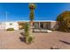 Exterior view of a single story home with desert landscaping at 8233 E Calypso Ave, Mesa, AZ 85208