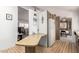 Bright kitchen with a breakfast bar area, white refrigerator, and view of the living room at 8233 E Calypso Ave, Mesa, AZ 85208