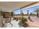 Covered patio featuring outdoor seating and views of the desert landscape at 8233 E Calypso Ave, Mesa, AZ 85208