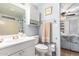 Bright bathroom with a shower, sink, vanity, and a view into the main bedroom at 8258 E Calypso Ave, Mesa, AZ 85208