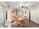 Charming dining room with hardwood floors, a ceiling fan, and a classic china cabinet at 8258 E Calypso Ave, Mesa, AZ 85208