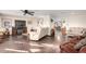 Inviting living room featuring wood floors, ceiling fan and plenty of natural light at 8258 E Calypso Ave, Mesa, AZ 85208