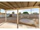 Covered patio overlooking a backyard with a block wall fence at 836 S Pasadena St, Mesa, AZ 85210