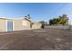 Home exterior overlooking backyard featuring partial block wall and covered patio at 836 S Pasadena St, Mesa, AZ 85210