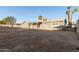 View of backyard featuring partial block wall and covered patio at 836 S Pasadena St, Mesa, AZ 85210