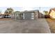 Charming single-story home with a gray exterior, covered entry, and low-maintenance landscaping at 836 S Pasadena St, Mesa, AZ 85210