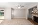 Spacious living room with tile flooring, decorative fireplace, and plenty of natural light at 836 S Pasadena St, Mesa, AZ 85210