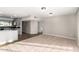 Open-concept living area adjacent to the kitchen, featuring tile floors and neutral paint at 836 S Pasadena St, Mesa, AZ 85210