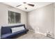 Bedroom with carpet flooring and futon under window with blinds at 9134 E Gary Ln, Mesa, AZ 85207