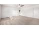 Living room featuring carpet and white painted brick walls at 9134 E Gary Ln, Mesa, AZ 85207