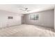 Neutral living room featuring carpet, window and air conditioning at 9134 E Gary Ln, Mesa, AZ 85207