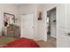 Bedroom featuring a sliding door closet, chest of drawers, and doorway, creating a warm atmosphere at 9341 W Willow Bend Ln, Phoenix, AZ 85037