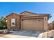 Charming home with brick details, a two-car garage and well-maintained landscaping at 9341 W Willow Bend Ln, Phoenix, AZ 85037