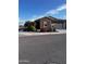 Charming single-story home with brick accents, landscaped front yard, and attached two-car garage at 9341 W Willow Bend Ln, Phoenix, AZ 85037
