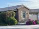 Attractive single-story home featuring brick veneer, desert landscaping, and a neutral color palette at 9341 W Willow Bend Ln, Phoenix, AZ 85037