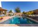 Outdoor pool area with patio seating, perfect for relaxing and enjoying the sunshine, ideal for entertaining at 9341 W Willow Bend Ln, Phoenix, AZ 85037