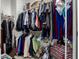 Walk-in closet maximizes vertical space and allows easy organization of clothes, shoes, and accessories at 9341 W Willow Bend Ln, Phoenix, AZ 85037