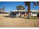 Backyard featuring mature trees and screened in patio off the back of the house at 10105 W Bolivar Dr, Sun City, AZ 85351