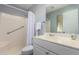 Bathroom with a shower-tub combo, grab bar, and vanity at 10105 W Bolivar Dr, Sun City, AZ 85351