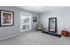 Bedroom with a window, ceiling fan, and a decorative chair at 10105 W Bolivar Dr, Sun City, AZ 85351