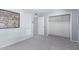 Bedroom with closet, sign artwork, and carpeted floors at 10105 W Bolivar Dr, Sun City, AZ 85351