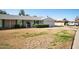 View of the cozy single-story home with an attached garage and well kept lawn at 10105 W Bolivar Dr, Sun City, AZ 85351