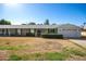 Charming single-story home showcasing its well-maintained yard and attached garage at 10105 W Bolivar Dr, Sun City, AZ 85351