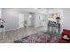 Open-concept living room featuring wood-look tile flooring and soft, neutral tones at 10105 W Bolivar Dr, Sun City, AZ 85351
