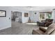 Inviting living area featuring tile flooring, ample seating, and plenty of sunlight at 10105 W Bolivar Dr, Sun City, AZ 85351