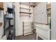 Utility room features organized shelving, a utility sink, and plenty of storage space at 10105 W Bolivar Dr, Sun City, AZ 85351