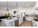 Open kitchen featuring a large center island, stainless steel appliances, and modern fixtures at 10464 Magnolia Rd, Gold Canyon, AZ 85118