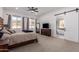 Comfortable main bedroom with a ceiling fan, backyard view, and an ensuite bathroom at 10464 Magnolia Rd, Gold Canyon, AZ 85118