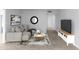 Modern living room featuring a comfortable couch, stylish decor, and sleek entertainment center with flatscreen TV at 10808 W Kelso Dr, Sun City, AZ 85351
