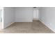 This open-concept living room boasts tile floors and neutral paint colors at 10808 W Kelso Dr, Sun City, AZ 85351