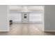 The living room has tile floors, neutral walls, and plenty of natural light from the sunroom at 10808 W Kelso Dr, Sun City, AZ 85351