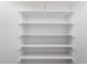 Bright walk-in pantry features ample storage space with multiple shelves at 10808 W Kelso Dr, Sun City, AZ 85351