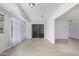 Bright sun room features tile floors, neutral paint, sheer curtains and slider to the backyard at 10808 W Kelso Dr, Sun City, AZ 85351