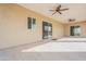 Covered patio area with tile flooring and multiple ceiling fans at 11416 S 208Th Ave, Buckeye, AZ 85326